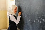 educ-schoolgirl at blackboard